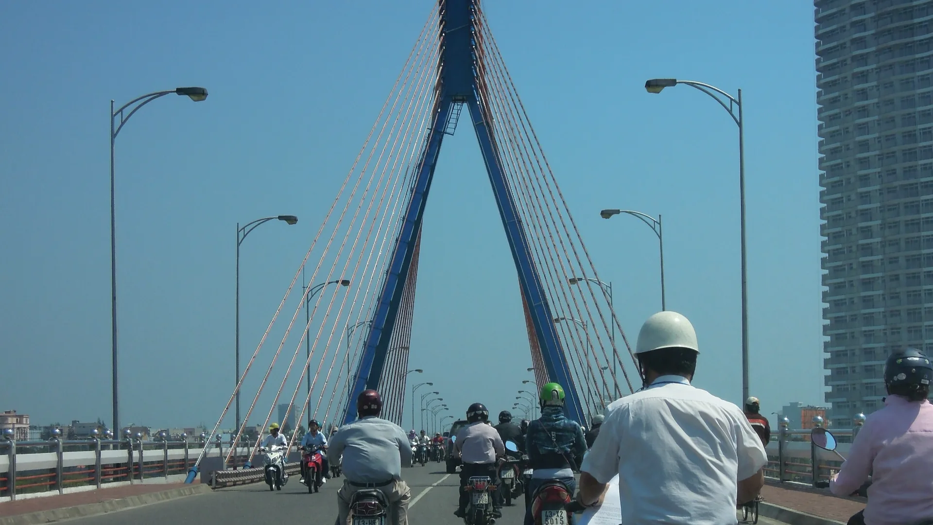 Da Nang dragon bridge Vietnam night illuminated — Da Nang's modern infrastructure makes it one of Vietnam's most convenient beach cities