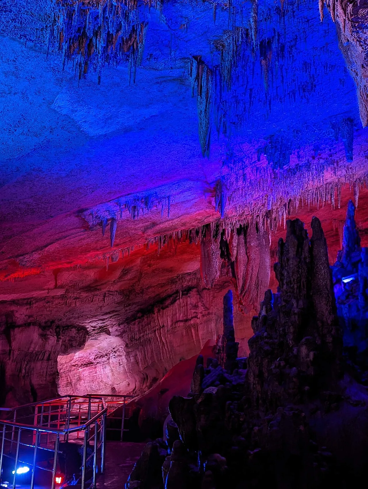 Calcite formations growing over millions of years in the depths of Paradise Cave