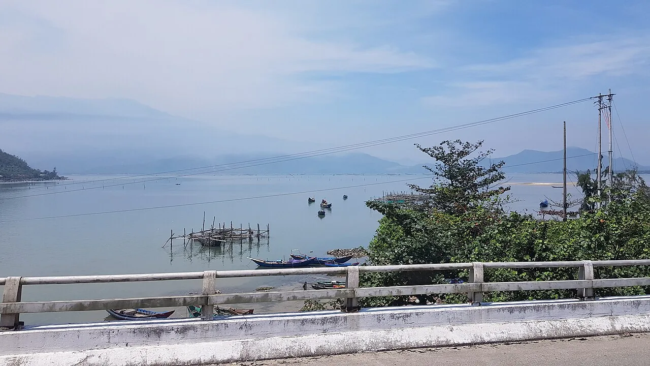 Lang Co's narrow sand spit between lagoon and sea, backed by the Hai Van Pass mountains