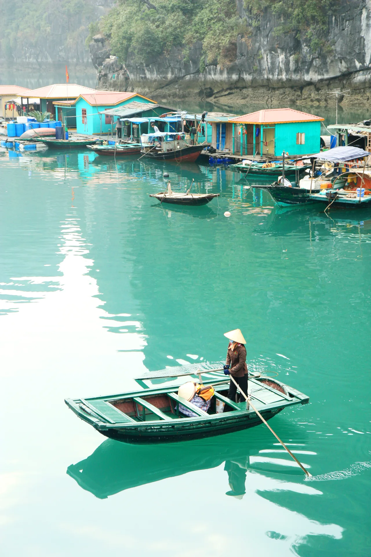 Floating fishing village Ha Long Bay Vietnam — traditional homes built on pontoons among the islands