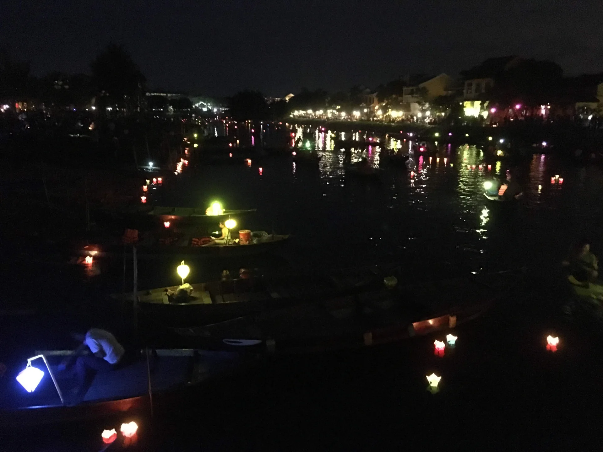 Hội An lantern-lit river during Tết season — the festival turns every street corner into an illuminated display