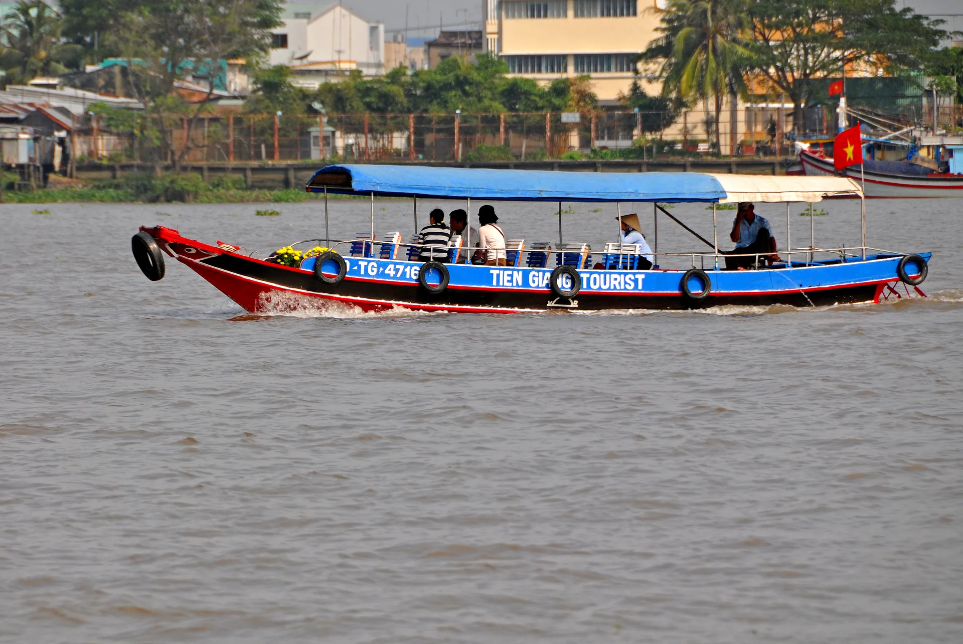 River ferry crossing in the Delta — bikes load easily and crossings are part of the southern motorbike experience