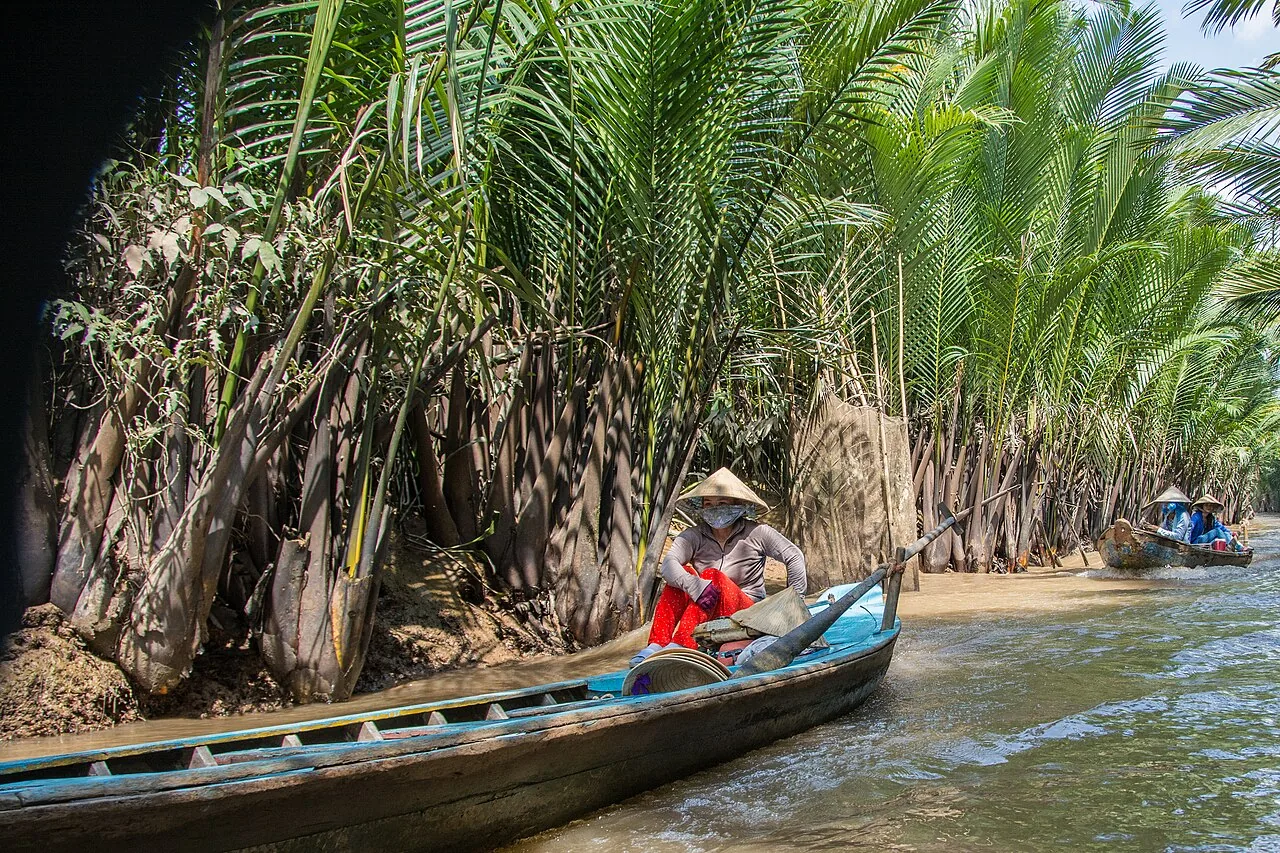 Sampan boats navigating the Mekong Delta's canal network