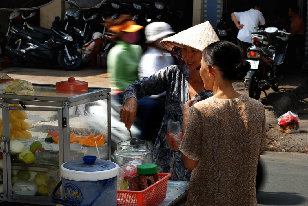 Vietnam street food vendor cart — mobile food vendors are ubiquitous across Vietnamese cities, serving dishes cooked fresh to order